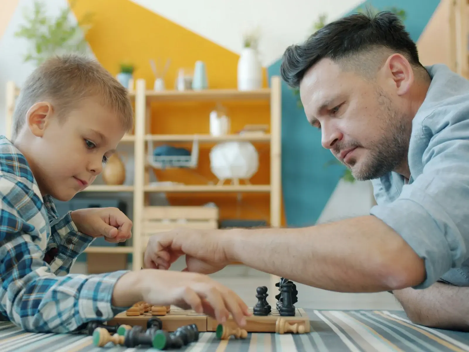 An image of a man and boy playing a game together
